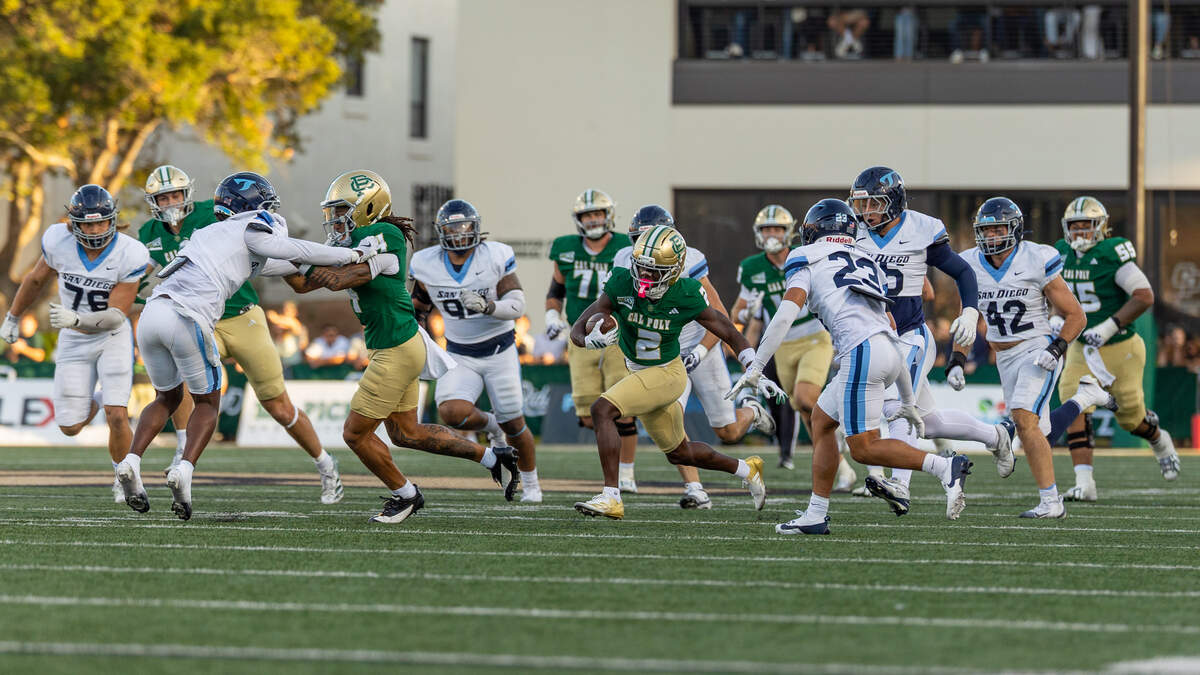 Cal Poly wide receiver Tayvion McCoy runs through the San Diego Toreros defense at Mustang Memorial Field on Sept. 19, 2026. The Mustangs lost to the Toreros 38-35 on Homecoming night on a last-minute field goal.